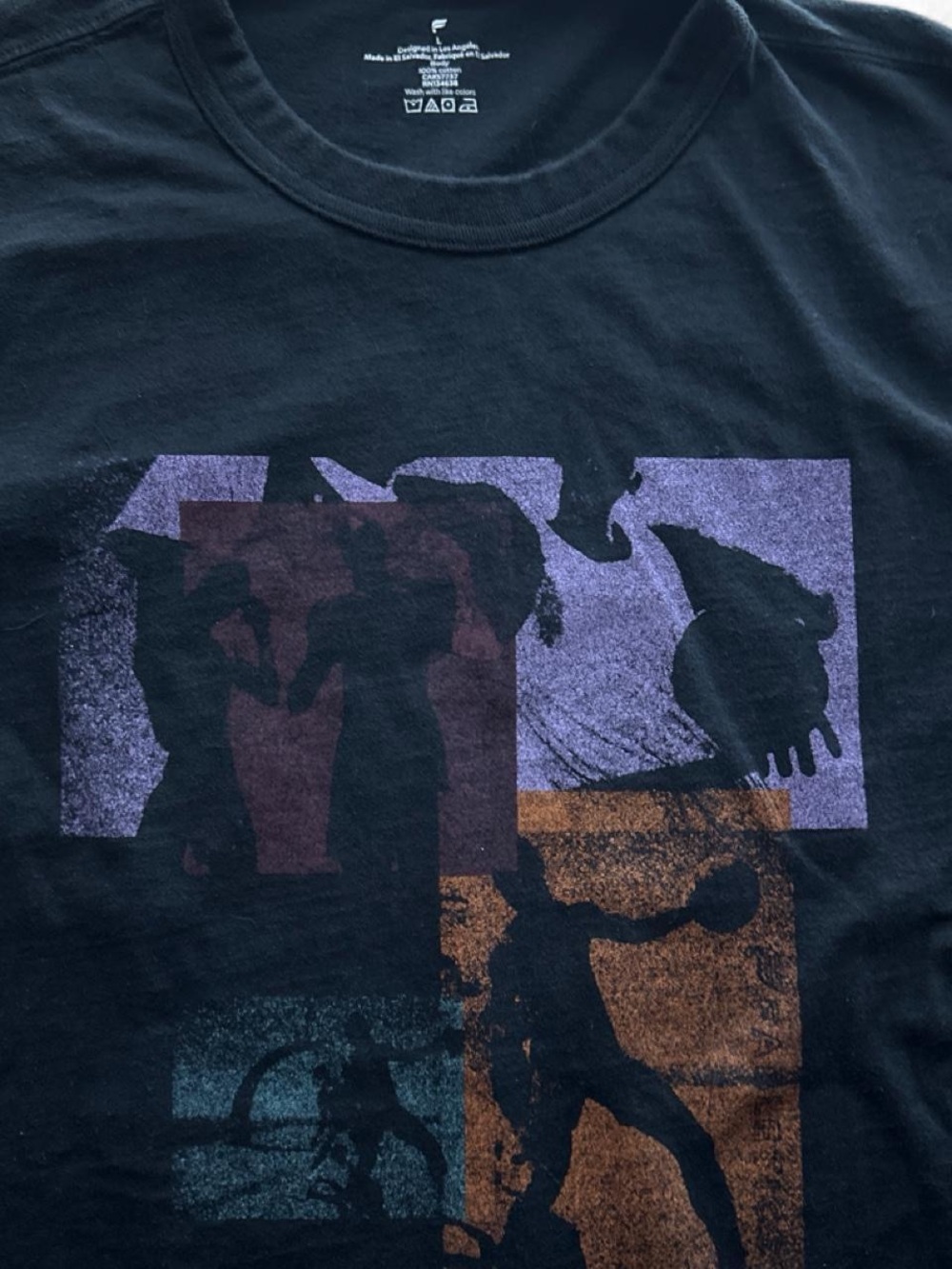 Fabletics Black Tee with Purple, Rust and Teal Graphic